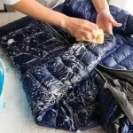 How to remove the oil stains on the down jacket for a long time? Can the down jacket be washed with a washing machine?