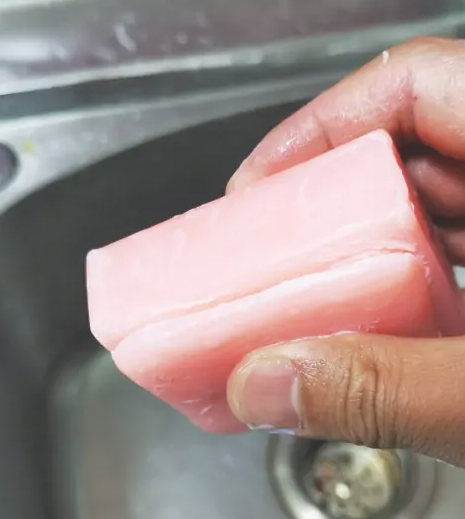 Put the old soap on top of the new soap